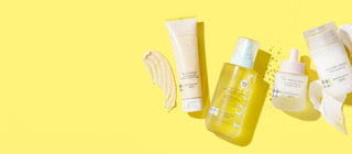 Wide image of Beekman 1802's Milk Scrub Cleanser, Milk Shake Toner Mist, Milk Drops Ceramide Serum, and Bloom Cream Daily Moisturizer next to their product swatches on a yellow background. 