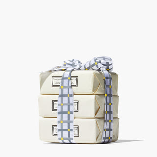 3 Beekman 1802 Pure 3.5 oz bar soaps all tied together in a gingham ribbon.