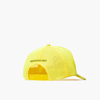 Image of the back of the Beekman 1802's Kindness Trucker Hat, which is all yellow with the words "Beekman 1802" in black above the snap adjustment piece, on a white background.