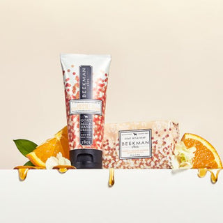 Honey and orange blossom 2 oz hand cream and 3.5 bar soap surrounded by sliced oranges with honey dripping off them. 