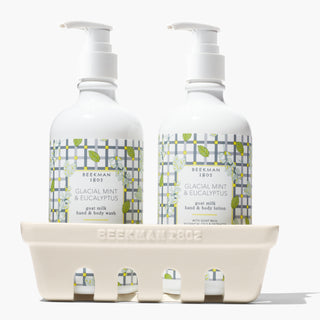Beekman 1802's Ceramic Caddy containing both Glacial Mint & Eucalyptus lotion and hand & body wash, all on a white background. 
