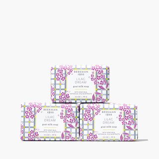 Beekman 1802's Lilac Dream 3-Pack Palm-Sized Bar Soap Set, which shows 3 bar soaps in purple and white packaging stacked on top of each other, on a white background.