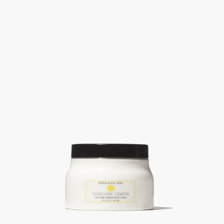 Jar of Beekman 1802's 16 ounce Sunshine Lemon Whipped Body Cream standing on a white background.