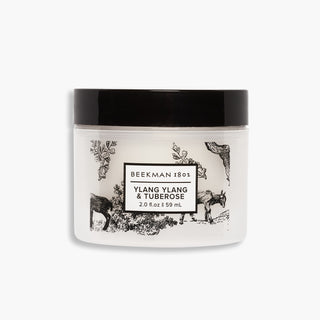 Jar of Beekman 1802's Ylang Ylang & Tuberose Whipped Body Cream on a white background.