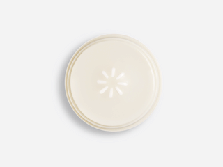 GIF of overhead shot of Beekman 1802's Bloom Cream Daily Moisturizer that is pumping product out.