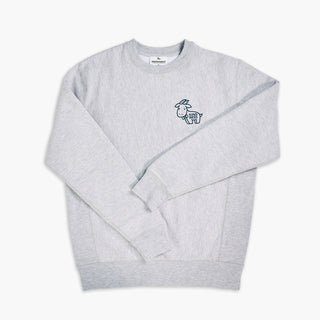Image of Beekman 1802's gray Kindness Sweatshirt with cartoon goatie in the front on a gray background.