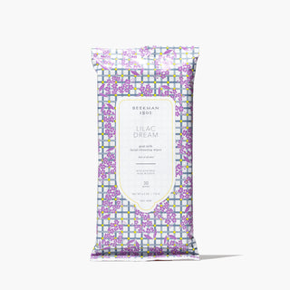 Pack of Beekman 1802's 30 count Lilac Dream Face Wipes that is designed with gingham and purple lilac flowers on the packaging, standing on a white background.