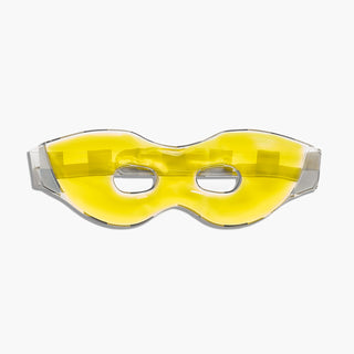 Beekman 1802's yellow Kindness Is My Superpower Gel Eye Masks on a light gray background.