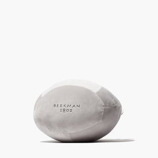 The bottom side of Beekman 1802's Goatie Squishmallow, revealing the "Beekman 1802" logo on the underside, on a white background.