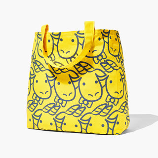 Beekman 1802's 2023 Limited edition yellow baby goat tote which has closeup image of goaties face all over the front in a pattern while standing on a white background.