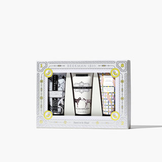 Gift box set of Beekman 1802's Handful of Kindness 3-Piece Hand Cream Sampler, which shows the vanilla absolute, pure, and lavender goat milk hand creams in the front, on a white background.