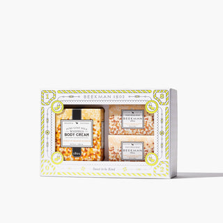 Box of Beekman 1802's Self-Kindness Spa Day Honey & Orange Blossom Bodycare Trio, which features one whipped body cream and two bar soaps in a box, on a white background. 