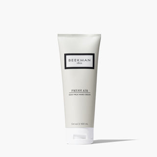 Tube of Beekman 1802's Fresh Air Hand Cream with white cap, standing on a white background. 