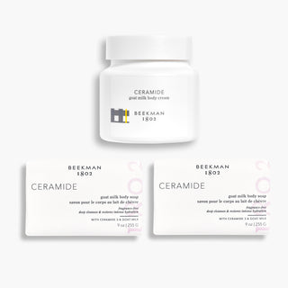 Image of Beekman 1802's Ceramide Bodycare Set with 2 goat milk ceramide bar soaps on the bottom, and one ceramide whipped body cream on top on a gray background.