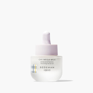 Mini Oh!Mega Milk fermented barrier boosting facial oil on a gray background.