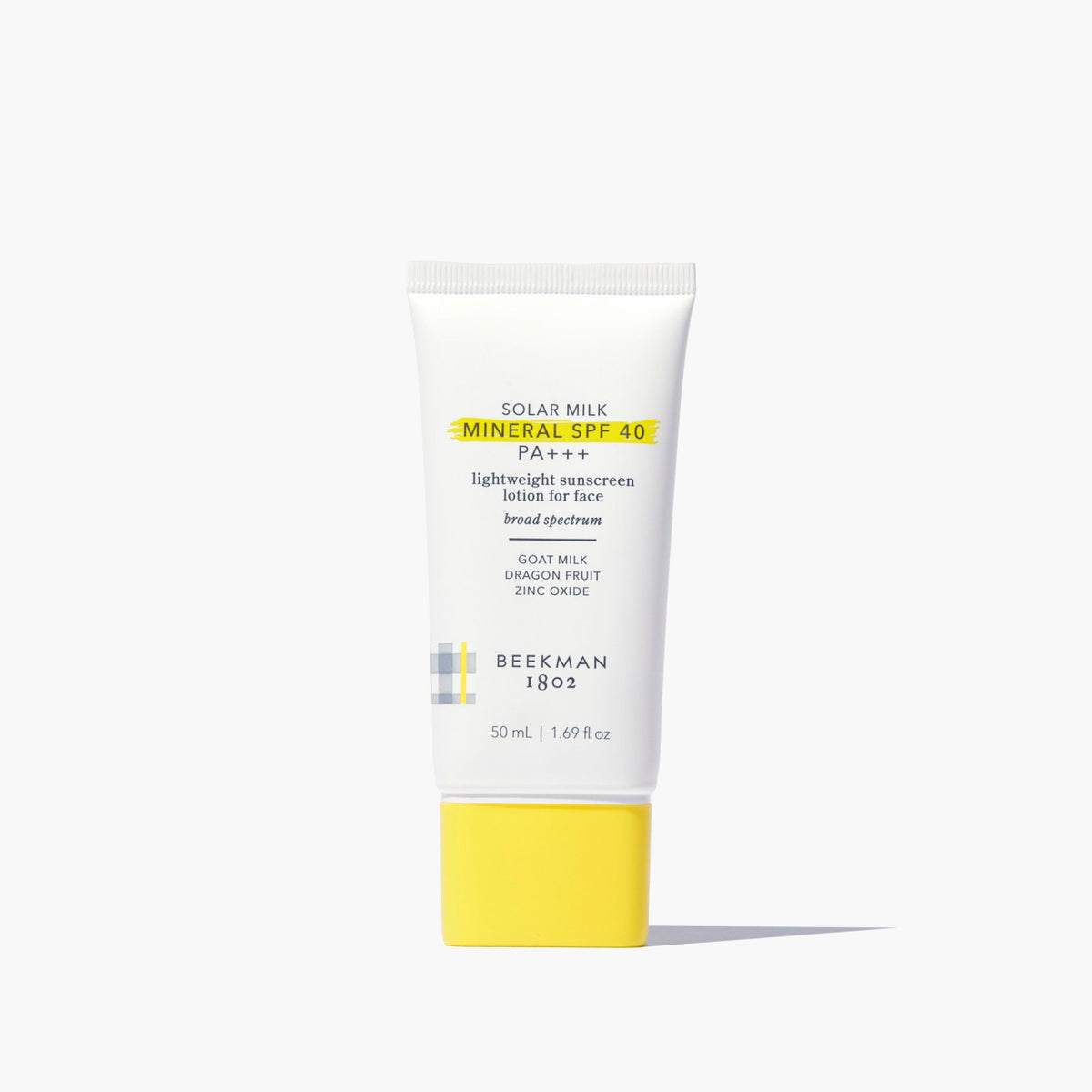 Beekman 1802 Solar Milk Mineral SPF 40 sunscreen lotion on a white background