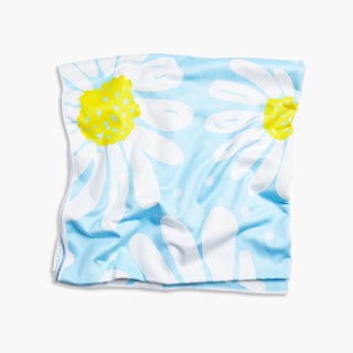 Bloom Towel- Light blue towel with white daisy flowers on it.