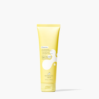 Yellow Tube of Beekman 1802's Vegan Goat Milk™ Oil Eliminating Foaming Gel Cleanser standing on a white background next to shadow. 