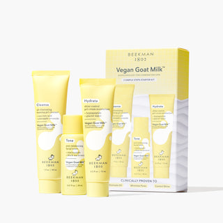 Yellow packaging box for Beekman 1802's Vegan Goat Milk™ 3-Step Oily + Combination Skin Starter Kit, which show all 3 mini products on the front of the box, with Yellow tubes of Beekman 1802's Vegan Goat Oil Eliminating Foaming Gel Cleanser, Pore Minimizing Facial Toner, and Shine Control Gel Cream Moisturizer, all lined up and standing next to each other in front of the box on a white background.