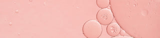 Up close shot of PHA ingredient colored pink in liquid form with small bubbles formed. 