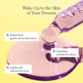 Up close shot of the dropper for Beekman 1802's Dream Booster Better aging serum, dropping the purple serum onto a yellow background, with the words "wake up to the skin of your dreams" on the top of the image, and three ingredient callouts which are bakuchiol. squalane, and jojoba oil.