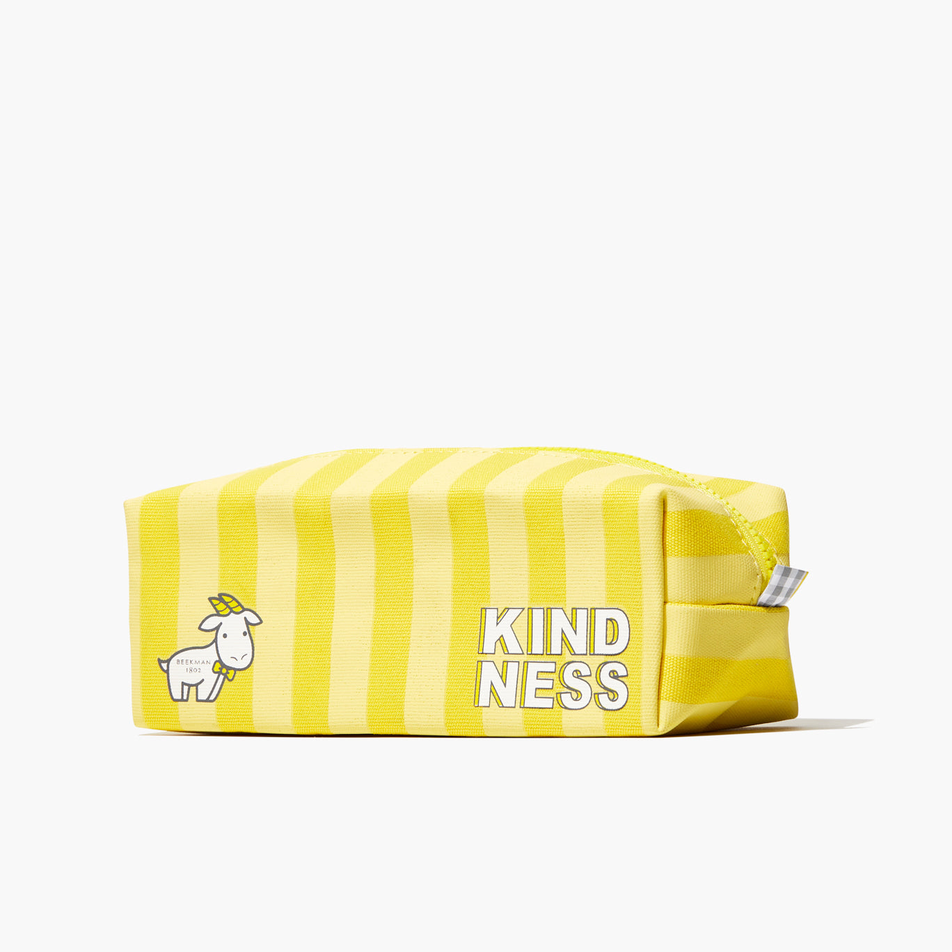 Front side of yellow Beekman 1802 striped dopp bag, which has the word 
