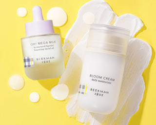 Oh! Mega Milk and Bloom Cream Moisturizers on yellow background