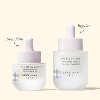 Mini & Full Size Version of Beekman 1802's Oh! Mega Milk Fermented Facial Oil on a cream background.