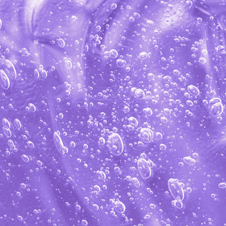 Up close shot of bubbles formed in the purple peptide ingredient drop. 