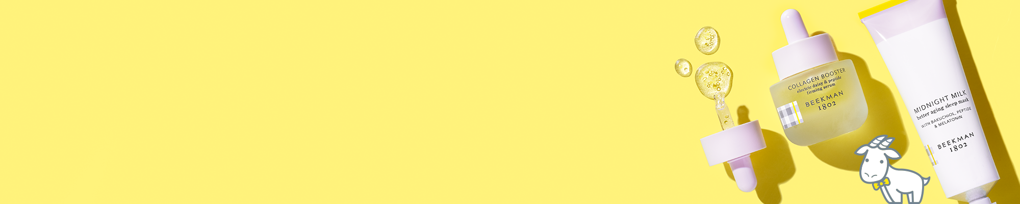 Bottle of Beekman 1802's Collagen Booster Electric Daisy & Peptide Firming Serum and tube of Beekman 1802's Midnight Milk Better Aging Sleep mask on a yellow background to the far right of the screen, with booster dropper to the left of the products, and serum droplets spilling out of dropper, next to a white cartoon goatie. 