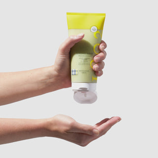 video of Hand squeezing out the beekman 1802 Sunshine Body Scrub 7.5% PHA Body Exfoliator onto their other hand.
