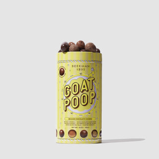 GIF of Yellow tin of Beekman 1802's 2023 Goat Poop Ultra Premium Chocolates, which has chocolates on top of the tin, and a hand coming from the right taking one of the chocolates, on a white background.