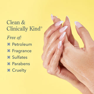 Closeup shot of models hands rubbing together on the right of the image and words on the left saying that the Wonder Milk is free of Petroleum, fragrance, sulfates, parabens, and cruelty, all on a yellow background.