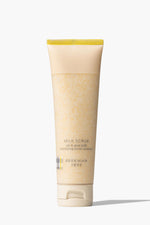 Beekman 1802's Milk Scrub Oat + Goat Milk Exfoliating Facial Cleanser on grey background.