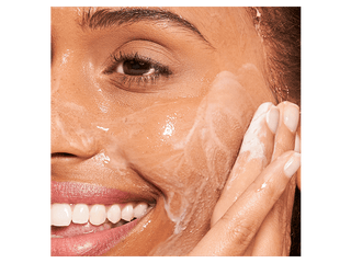 Milk Wash Exfoliating Jelly Cleanser Being Used on Face