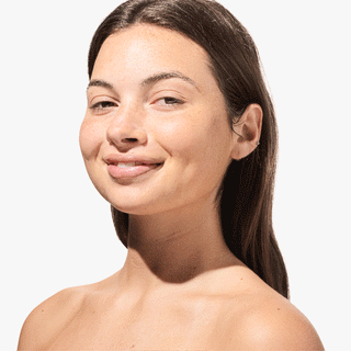 GIF of a girl wiping her makeup off with the Ceramide Face Wipe and showing the used wipe to the camera.