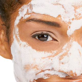 A closeup image of a model wearing the Milk Foam Bubble Mask on her face.