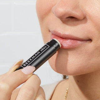 closeup of models lips while they're applying the Vanilla absolute lip balm.